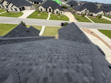 Completed dark asphalt shingle roof photographed by Fortress Roof Systems